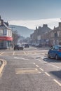 Warm February Weather and Hazy Sky Looking Up Main Street Largs on the West Coast of Scotland Royalty Free Stock Photo