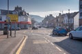 Warm February Weather and Hazy Sky Looking Up Main Street Largs on the West Coast of Scotland Royalty Free Stock Photo