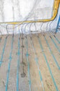 Warm floor cable installation on concrete at a construction site Royalty Free Stock Photo