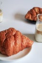 Warm Fresh Buttery Croissants with coffee for breakfast. French and American Croissants and Baked Pastries. Royalty Free Stock Photo