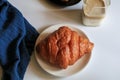 Warm Fresh Buttery Croissants with coffee for breakfast. French and American Croissants and Baked Pastries. Royalty Free Stock Photo