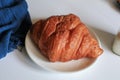 Warm Fresh Buttery Croissants with coffee for breakfast. French and American Croissants and Baked Pastries. Royalty Free Stock Photo