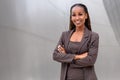 Warm, friendly, beautiful cheerful african american executive business woman at the workspace office Royalty Free Stock Photo