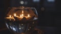 Warm Glow of Tea Lights in a Decorative Glass Holder at Night Royalty Free Stock Photo