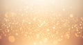 A warm, glowing bokeh texture featuring an array of sparkling lights on a soft Royalty Free Stock Photo