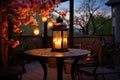 warm, glowing lantern on an outdoor patio at dusk