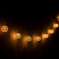 Warm Glowing String Lights With Decorative Mesh Bulbs Hanging Beautifully Royalty Free Stock Photo