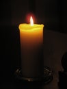 Warm Golden Light from Glowing Church Candle Royalty Free Stock Photo
