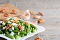 Warm green spring bean salad recipe. Home green spring bean salad with cottage cheese, raw pelled walnuts, garlic