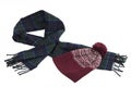 Warm greenish-blue wool scarf and red cap with winter pattern an