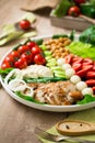 Warm grilled chicken salad with vegetables and fruits