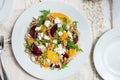 Warm Healthy quinoa, brown rice, cooked beetroot and orange salad