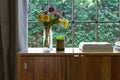 Warm interior looking onto a green hedge garden outlook