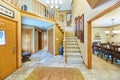 Warm and Inviting Home Interior with Staircase and Dining Area