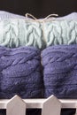 Warm knitted blankets folded stack. Comfort and convenience