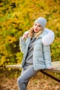 Warm knitwear. Clothes for rest. Girl relaxing in nature wearing knitwear suit and jacket. Model knitwear clothes leaves