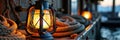 Warm lantern light on nautical ship deck with coiled rope at sunset Royalty Free Stock Photo