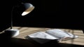 Warm Light From Desk Lamp Illuminating Open Textbook on Wooden Surface During Quiet Evening Study Session Royalty Free Stock Photo