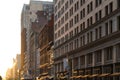 Warm light of sunset shines on the buildings along 23rd Street in New York City Royalty Free Stock Photo