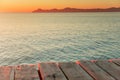 Warm morning light in summer vacation holiday resort. Pier in orange sunrise colors