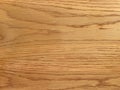 .Warm oak wood texture with natural grain patterns, ideal for a polished wooden surface background in design and carpentry Royalty Free Stock Photo