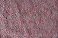 Warm pink ornamental lacy fabric Royalty Free Stock Photo