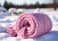 Warm pink wool scarf in the snow. Winter time. AI generated