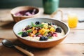 warm polenta porridge in a rustic bowl with blackberry topping