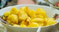 Warm potatoes with seasonings on a white plate - close up