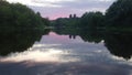 Warm quiet evening, sunset time, sketch of a river flowing into the great river Volga