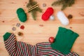 Warm red, green and white homemade knitted sweater, fir branches and christmas balls Royalty Free Stock Photo