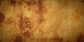 Warm rusty parchment background with heavy mottling. Royalty Free Stock Photo