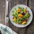 Warm salad with fried eggplant, arugula, cherry tomatoes,