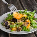 Warm salad with fried eggplant, arugula, cherry tomatoes,