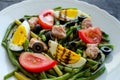 Warm salad with green beans, tuna, tomatoes and boiled eggs Royalty Free Stock Photo