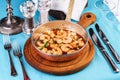 Warm salad of grilled fish pieces, shrimps and mussels in a frying pan, with grilled vegetables Royalty Free Stock Photo