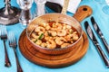 Warm salad of grilled fish pieces, shrimps and mussels in a frying pan, with grilled vegetables Royalty Free Stock Photo