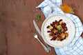 Warm salad of grilled Jerusalem artichoke and boiled red beans with olive oil and vinegar dressing on a white clay plate Royalty Free Stock Photo