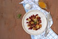 Warm salad of grilled Jerusalem artichoke and boiled red beans with olive oil and vinegar dressing on a white clay plate Royalty Free Stock Photo