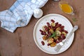 Warm salad of grilled Jerusalem artichoke and boiled red beans with olive oil and vinegar dressing on a white clay plate Royalty Free Stock Photo