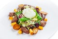 Warm salad with turkey liver and poached egg