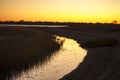 Warm sky over a marsh at Milford Point, Connecticut. Royalty Free Stock Photo