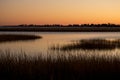 Warm sky over a marsh at Milford Point, Connecticut. Royalty Free Stock Photo