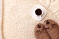 Warm soft blanket, cup of hot espresso coffee, woolen socks. Winter fall autumn cozy still life. Lazy weekend morning concept. Royalty Free Stock Photo