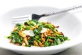 warm spinach salad with pine seeds