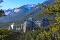 Warm spring sunbeams shine on the infamous spooky Fairmont Banff Springs Hotel.