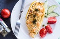 warm stuffed zucchini with chicken and vegetables on a white plate, top view Royalty Free Stock Photo