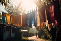 warm summer day, with clotheslines hung with colorful laundry and the warm sun shining