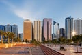 A warm sun illuminates the Abu Dhabi Skyline