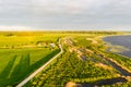 Warm, Sunny Summer Evening, Drone View Over Empty Road on Swampy Lake Coastline Royalty Free Stock Photo